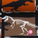 Teplákovina potisk dinosauři na oranžovo-hnědé, lehce počesaná