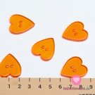 Knoflík srdíčko hladké, průhledné oranžové