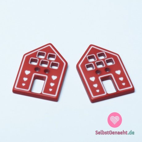 Knopf in Form eines Hauses mit roten Herzen