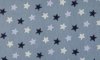 Sternendruck aus Baumwollpopeline auf staubigem Blau