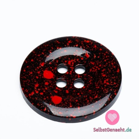 Mega großer schwarzer Knopf mit roten Spritzern