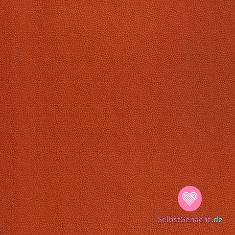 Baumwollleinen mit winzigen orangefarbenen Tupfen auf Backstein
