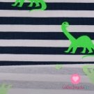 Úplet potisk tmavomodré proužky na bílé s neonkově zelenými dinosaury